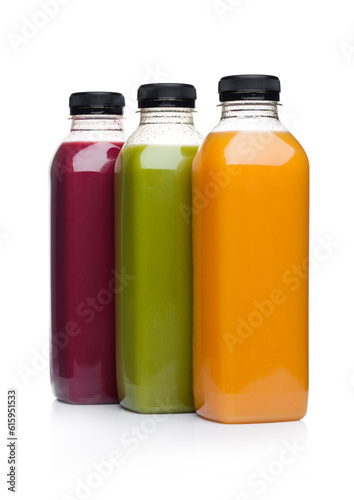 Bottles of healthy fruit juice smoothie on white background