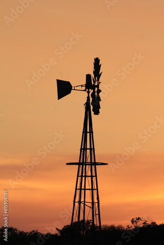  Farm windmill at sunset