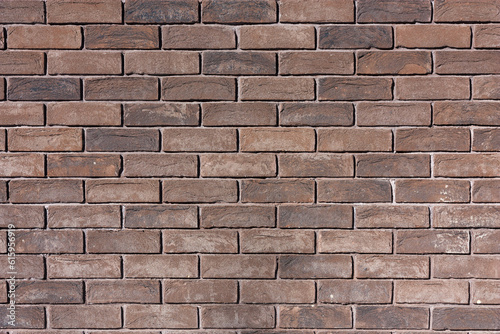 фотографія Texture of the old closeup brown brick wall.