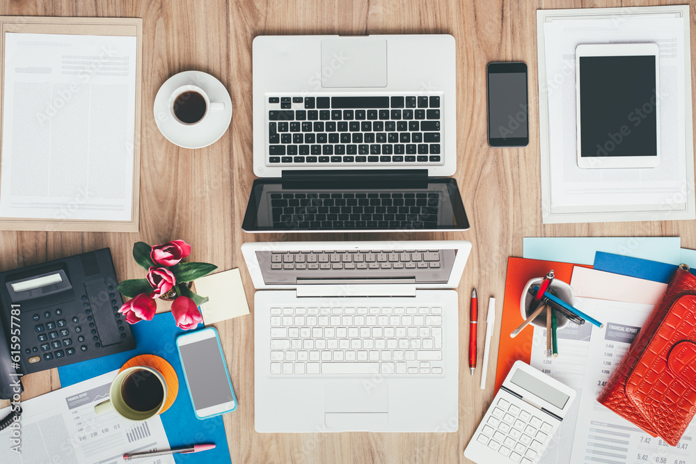 Feminine creative messy desktop facing a male simple and standard desktop, coworking and business concept Feminine creative messy desktop facing a male simple and standard desktop, coworking and business concept