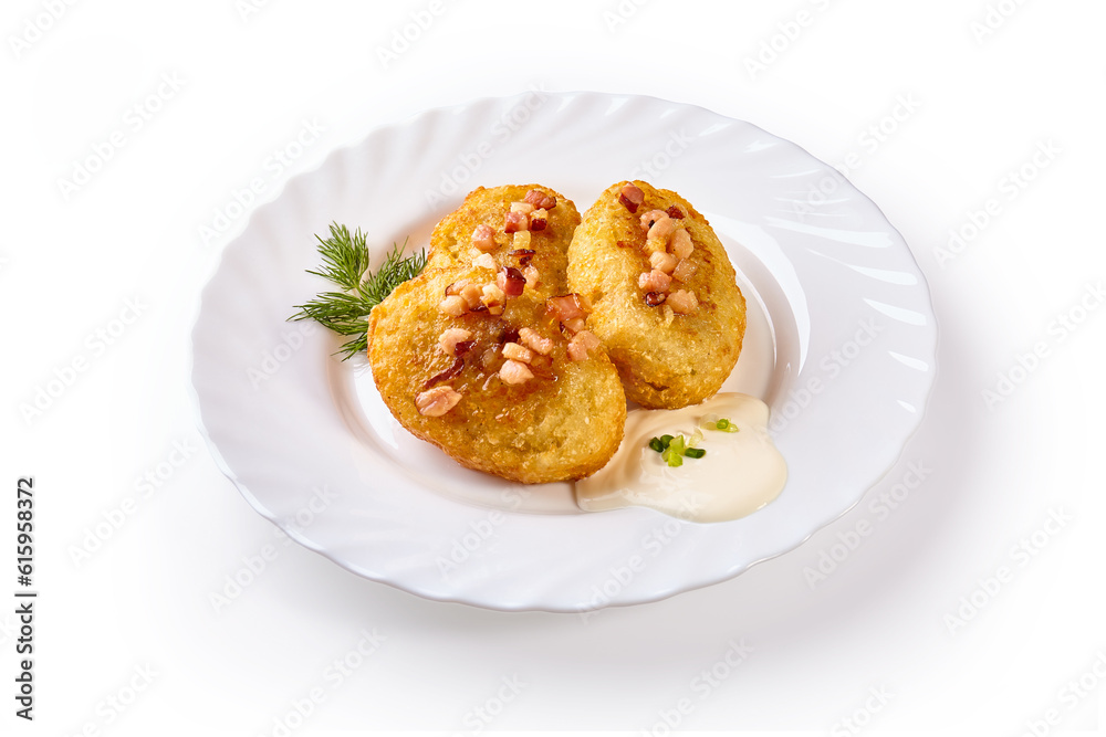 Potato dumplings - a traditional regional dish. Polish and Lithuanian cuisine. With fried bacon on a white plate.