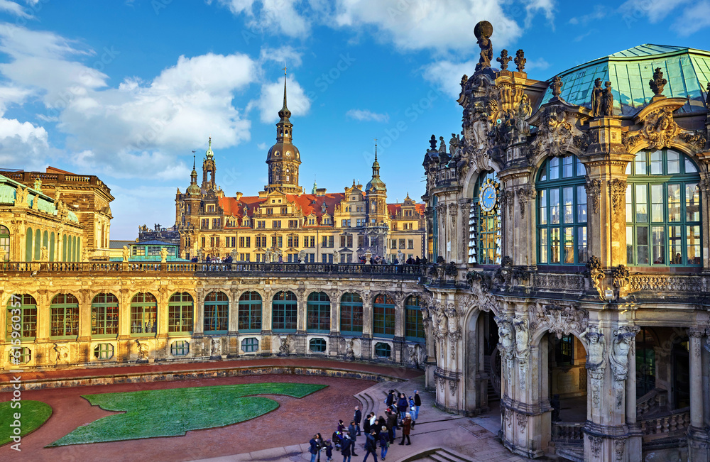 Dresden, Germany. Zwinger Palace internal yard. View to royal palace residence famous german landmark in old town of capital of Saxony region. Evening sunset with blue sky.