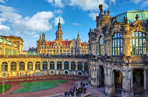 Dresden, Germany. Zwinger Palace internal yard. View to royal palace residence famous german landmark in old town of capital of Saxony region. Evening sunset with blue sky.