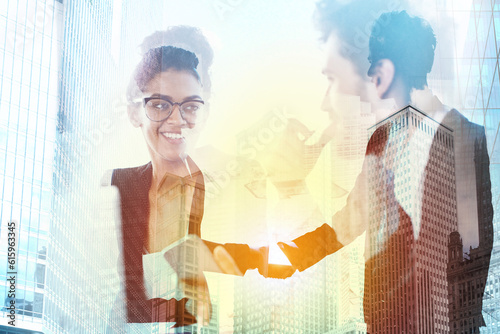 Handshake of two businessperson in a modern office. concept of partnership and teamwork. double exposure