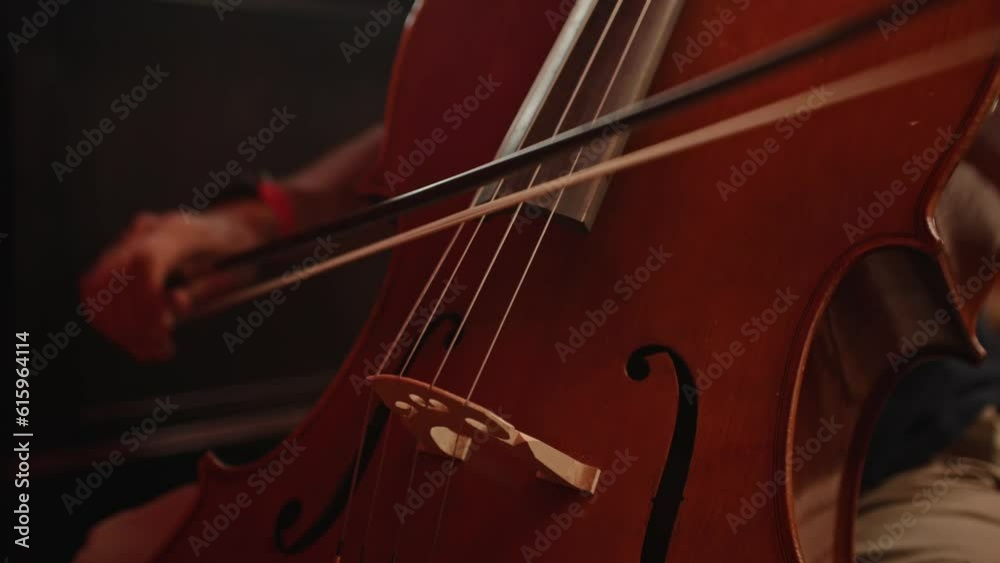 Man playing cello close up of bow Man playing cello close up of bow