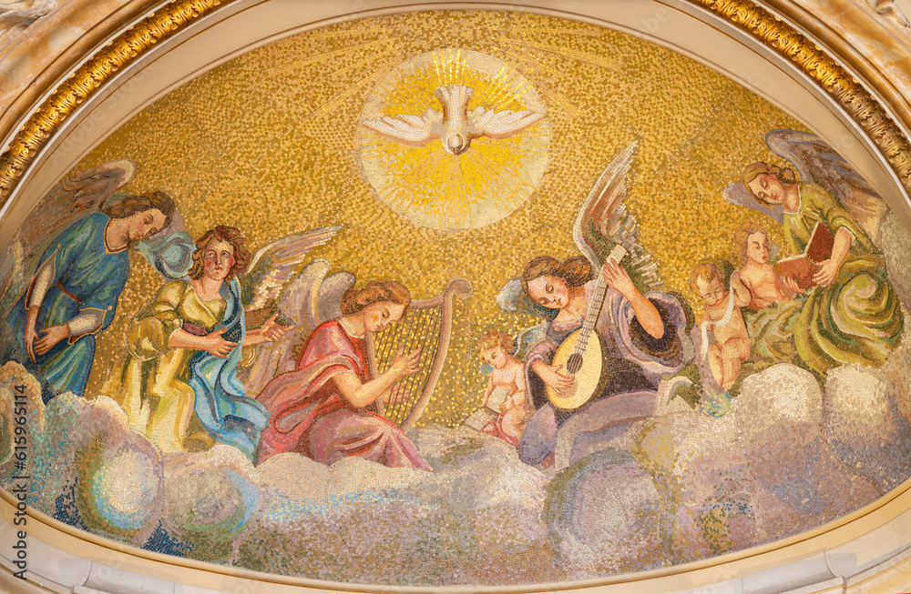 NAPLES, ITALY - APRIL 22, 2023:  The mosaic of Holy Spirit among the angels with the music instruments in the church Basilica dell Incoronata Madre del Buon Consiglio from 20. cent.