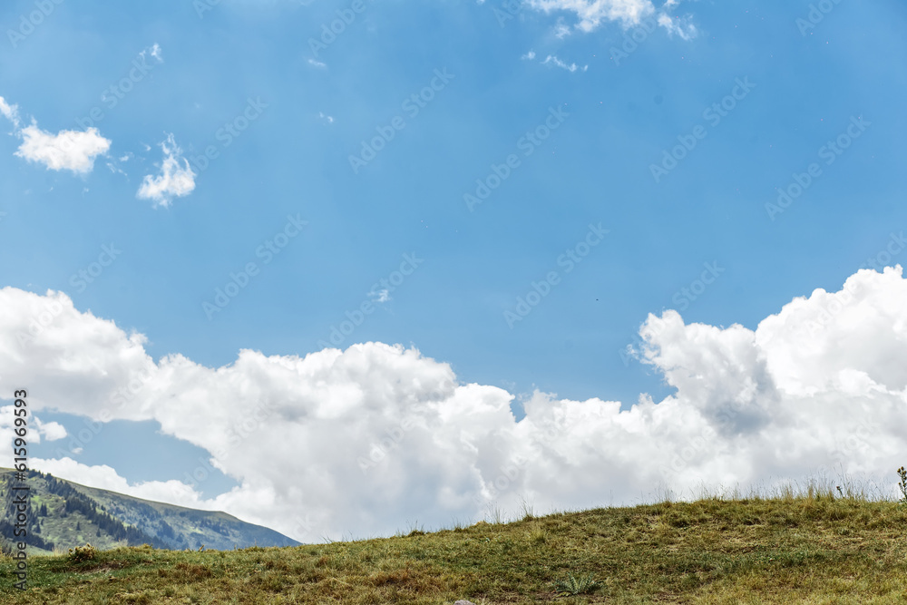 Panoramic view of beautiful mountain in the clouds landscape. Fabulous misty morning scene of nature. Amazing natural background Panoramic view of beautiful mountain in the clouds landscape. Fabulous misty morning scene of nature. Amazing natural background