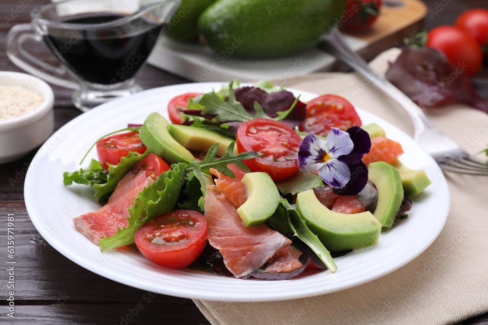 Tasty vegetable salad with soy sauce served on wooden table, closeup