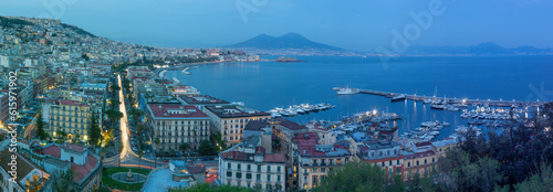 The panorama of Naples in the evening dusk. 