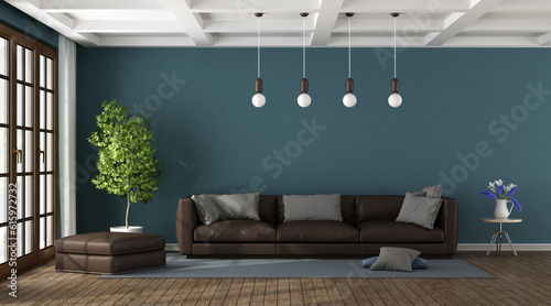 Fotografía Brown sofa in a blue living room with large window and coffered ceiling - 3d ren