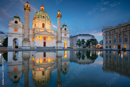 Cityscape image of Vienna with St. Charles Church during twilight blue hour.