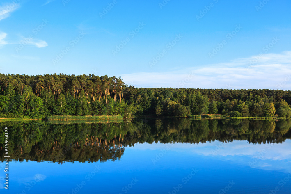 Lake Roth in Bavaria at sunset of a summer day with the outburst of a blue sky