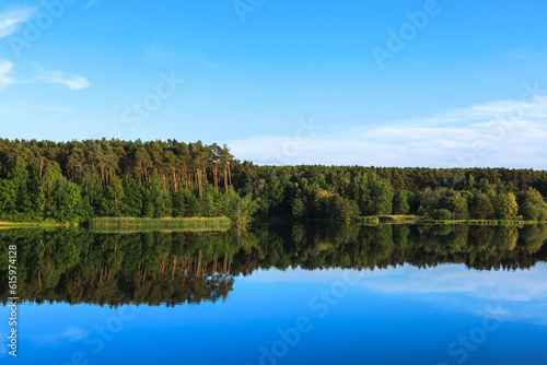 Lake Roth in Bavaria at sunset of a summer day with the outburst of a blue sky