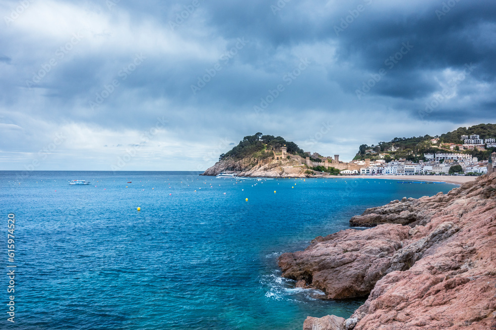 Stormy weather on Spanish mediterranean coast at the Costa Brava with village Tossa de Mar and his medieval castle