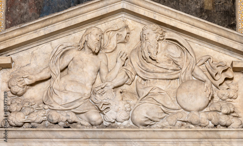 NAPLES, ITALY - APRIL 23, 2023: The marble relief of Holy Trinity in the church Chiesa di San Giovanni a Carbonara by Giovanni Domenico D’Auria and Annibale Caccavello (1557 - 1566).