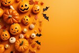 Hallowen stuff pumpkin orange background top view with space for text