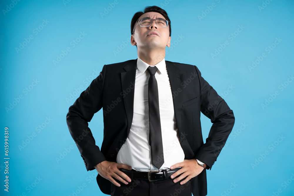 image of young businessman posing on blue background image of young businessman posing on blue background
