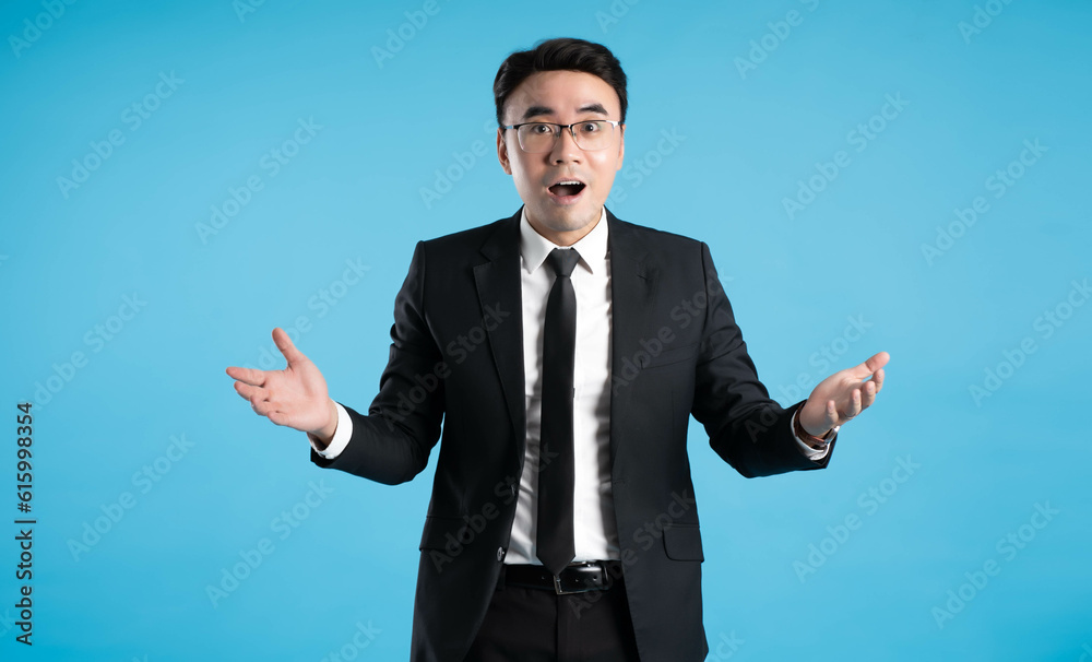 image of young businessman posing on blue background image of young businessman posing on blue background