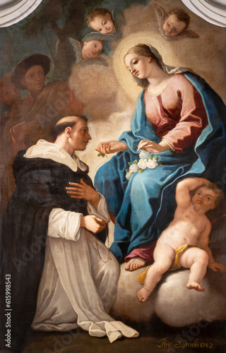 NAPLES, ITALY - APRIL 24, 2023: The painting of Madonna with the St. Dominic in the church Chiesa di San Pietro Martire by Antonio Sarnelli (1742). 