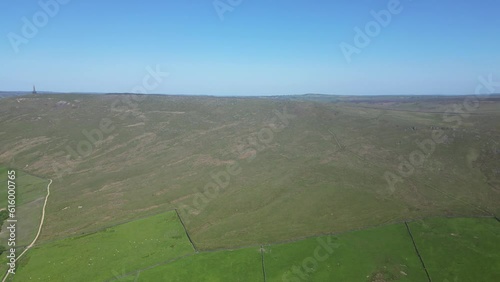 climbing from 15 - 300 over lumbutts church in todmorden , showcasing stoodley pike in the left of the horizon, a famous local land mark from the medieval era  photo