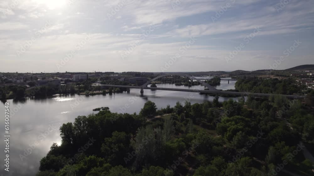 Lusitania Bridge spans Guadiana river on calm waters. Merida, Spain Lusitania Bridge spans Guadiana river on calm waters. Merida, Spain