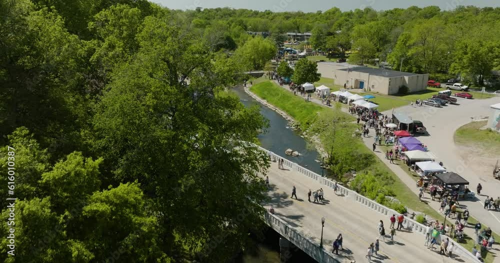 Fly Over Crowded People During Dogwood Festival In Downtown Siloam Springs, Arkansas, USA. Aerial Drone Shot Fly Over Crowded People During Dogwood Festival In Downtown Siloam Springs, Arkansas, USA. Aerial Drone Shot