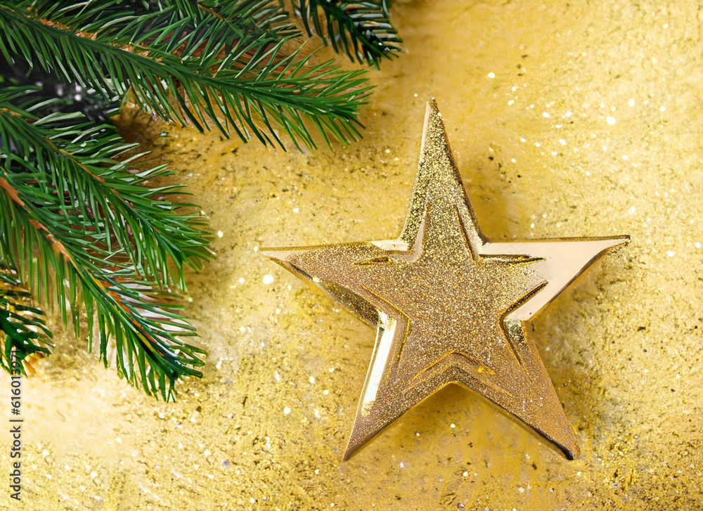 Close up red ornament and gold star hanging from branch of Christmas tree Close up red ornament and gold star hanging from branch of Christmas tree
