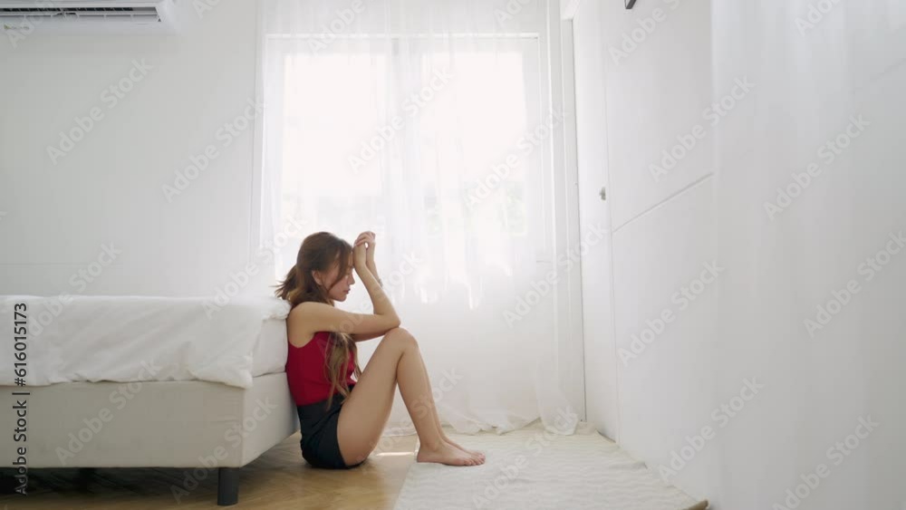 4K Sadness young Asian woman sitting in bedroom with feeling broken and crying. Loneliness girl living alone with stress and negative emotion. People mental health, depressed and life problem concept. 4K Sadness young Asian woman sitting in bedroom with feeling broken and crying. Loneliness girl living alone with stress and negative emotion. People mental health, depressed and life problem concept.