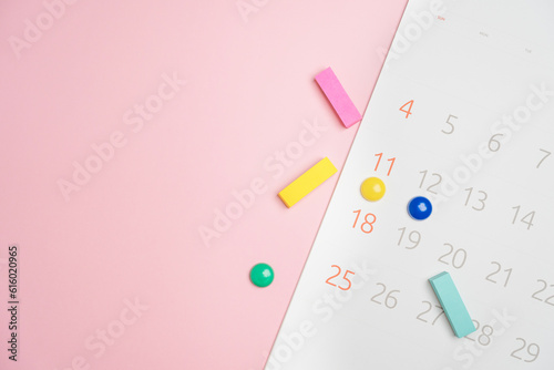 close up of calendar on the pink table background, planning for business meeting or travel planning concept
