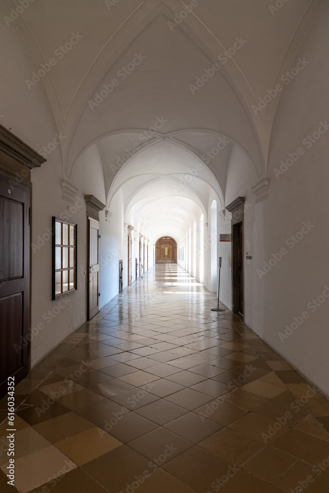 light flooded long corridor with many windows, perspective view