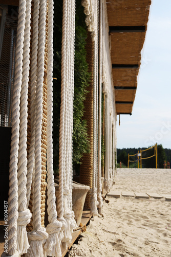 Rope curtain on a sandy beach photo