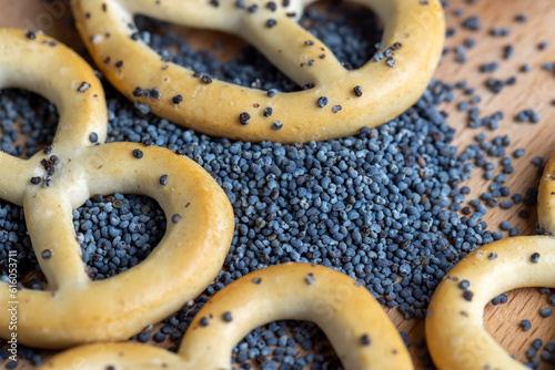 Poppy seed coating dried bagels on the table photo