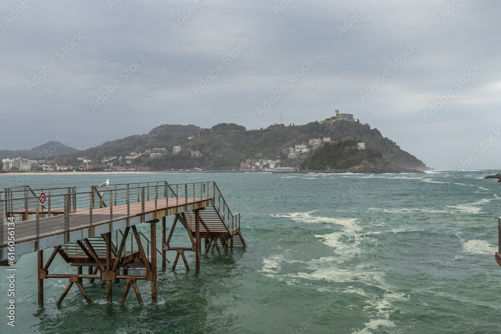 Stormy ocean and dramatic cloudy weather in San Sebastian port,