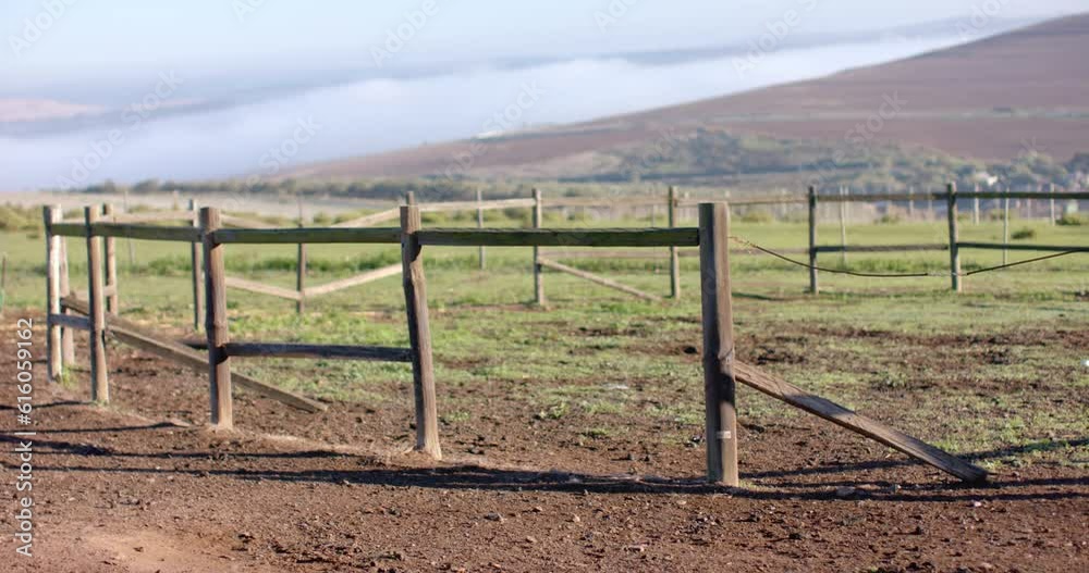 Wooden fence on agricultural field at countryside on sunny day, slow motion Wooden fence on agricultural field at countryside on sunny day, slow motion
