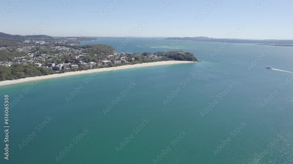 Shoal Bay Suburb And Scenic Beach With Serene Blue Waters On A Sunny Day In Port Stephens, NSW, Australia. - aerial Shoal Bay Suburb And Scenic Beach With Serene Blue Waters On A Sunny Day In Port Stephens, NSW, Australia. - aerial