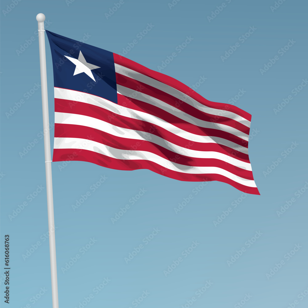 Fototapeta premium Waving flag of Liberia on flagpole. Template for independence day