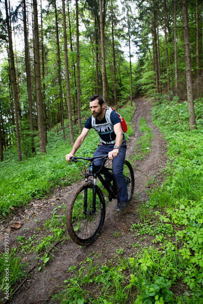 man on a mountain bike in the forest