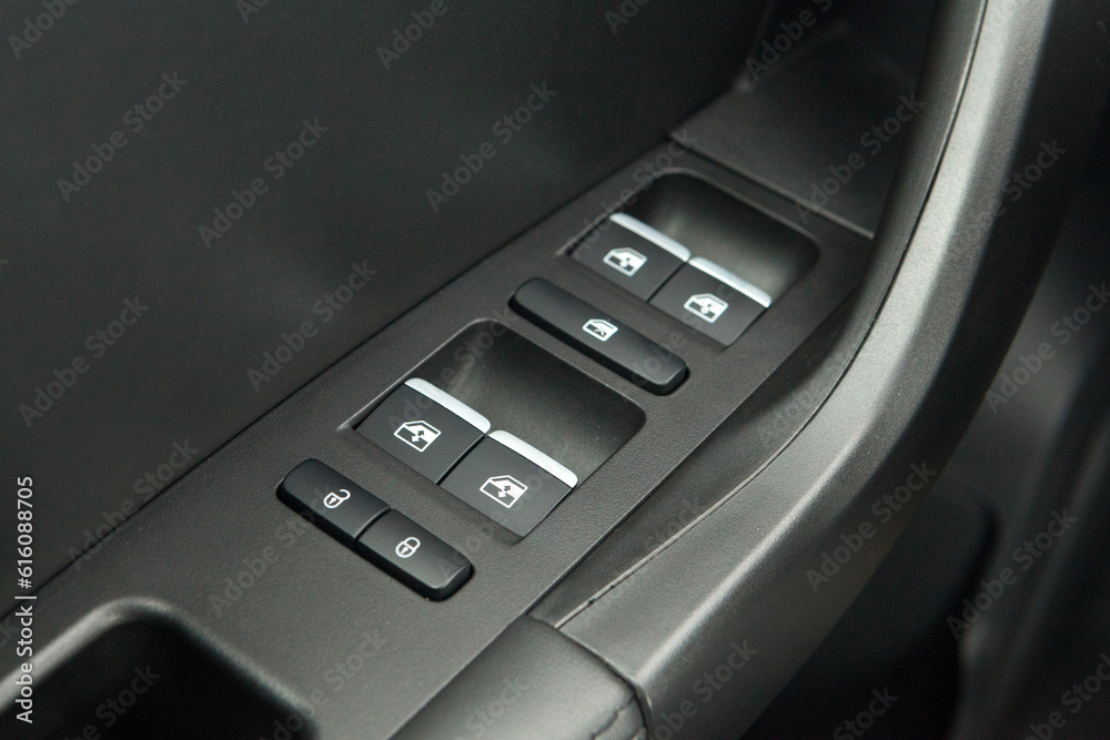 Car interior on the doors inside car door handle with power window control unit Car interior on the doors inside car door handle with power window control unit