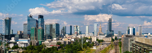 Warsaw city center aerial landscape, skyscrapers panorama under blue cloudy sky