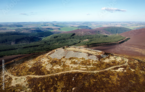 Tap o’ Noth prehistoric hillfort Grampian, Scotland. Massive vitrified wall of Neolithic core. Outer rampart encloses large early Medieval settlement photo