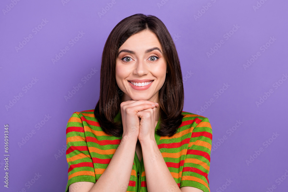Photo of cheerful excited woman dressed striped cardigan smiling arms chin isolated violet color background Photo of cheerful excited woman dressed striped cardigan smiling arms chin isolated violet color background
