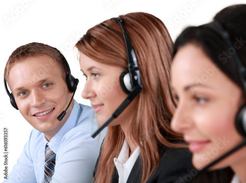 Businessman with Headset and Colleagues in the Foreground - Isolated