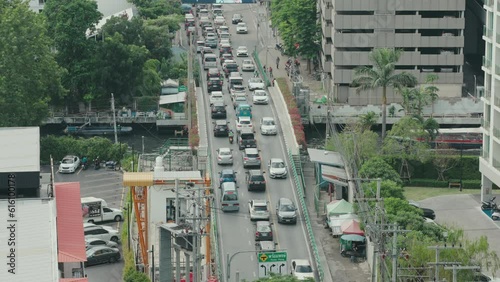 Top views the traffic jam in Bangkok near Prompong and also The Khlong Saen Saep Express Boat coming. photo