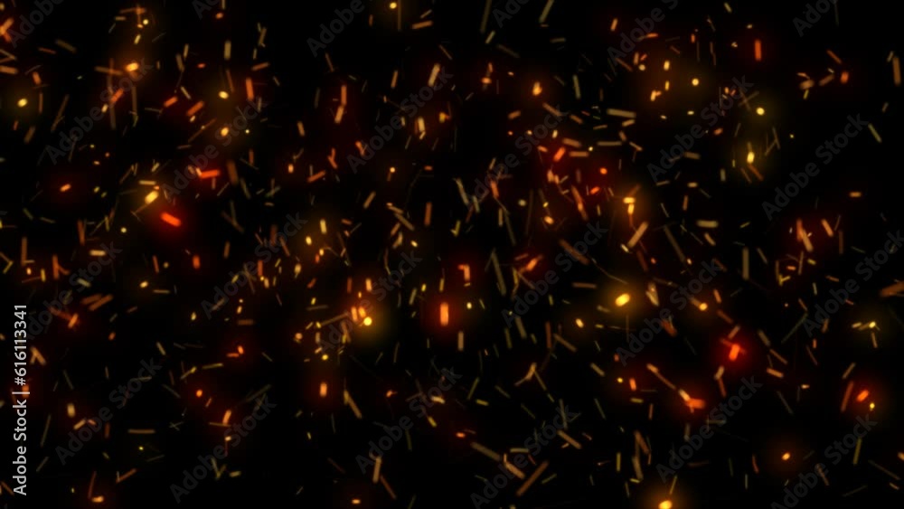 Abstract glowing yellow orange flying sparks from campfire background