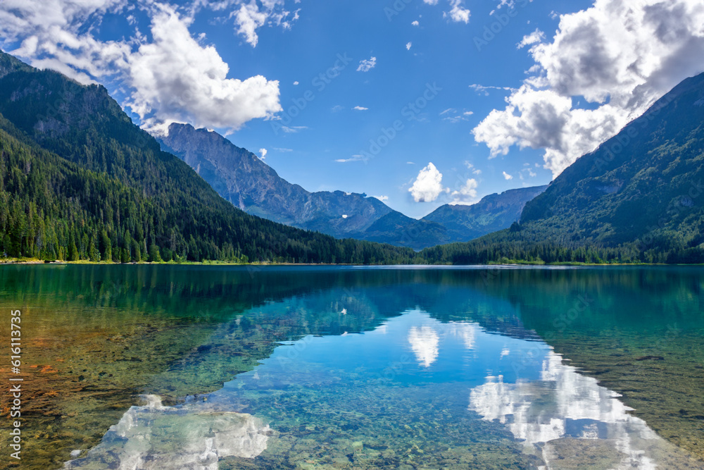 Mountain lake Relax by the side of a crystal-clear lake nestled at the foot of towering mountains, and soak in the beauty of the mountains and their reflections Mountain lake Relax by the side of a crystal-clear lake nestled at the foot of towering mountains, and soak in the beauty of the mountains and their reflections