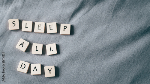 Sleep all day. Sleeping concept with sleeping mask and lettering. Copy space for text. high angle view. Cozy background
