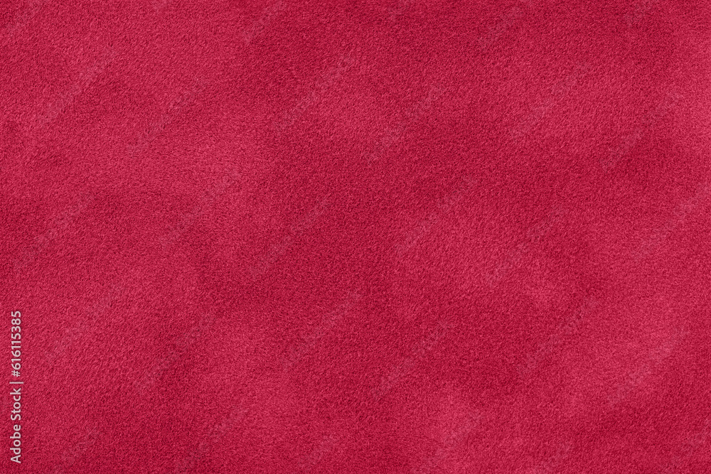 Fototapeta premium Texture of velvet dark red matte background, macro. Suede fabric with wine pattern.