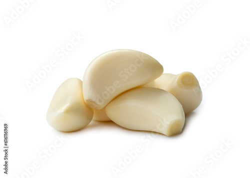 Peeled garlic cloves in stack isolated on white background with clipping path. and shadow in png file format