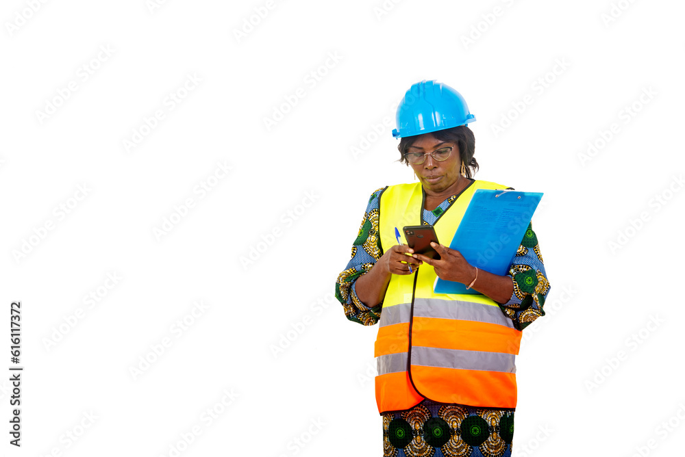 close up of beautiful woman engineer in hard hat with clipboard handling mobile phone.