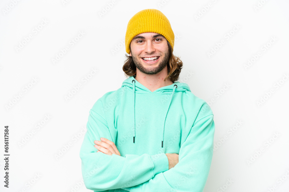 Young handsome man isolated on white chroma background keeping the arms crossed in frontal position